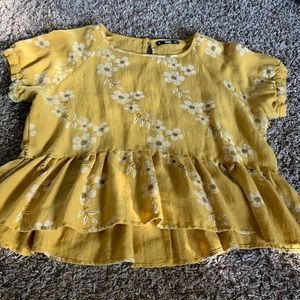 Yellow shirt with white flowers